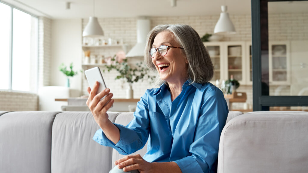 A woman receiving a digital gift on a smartphone