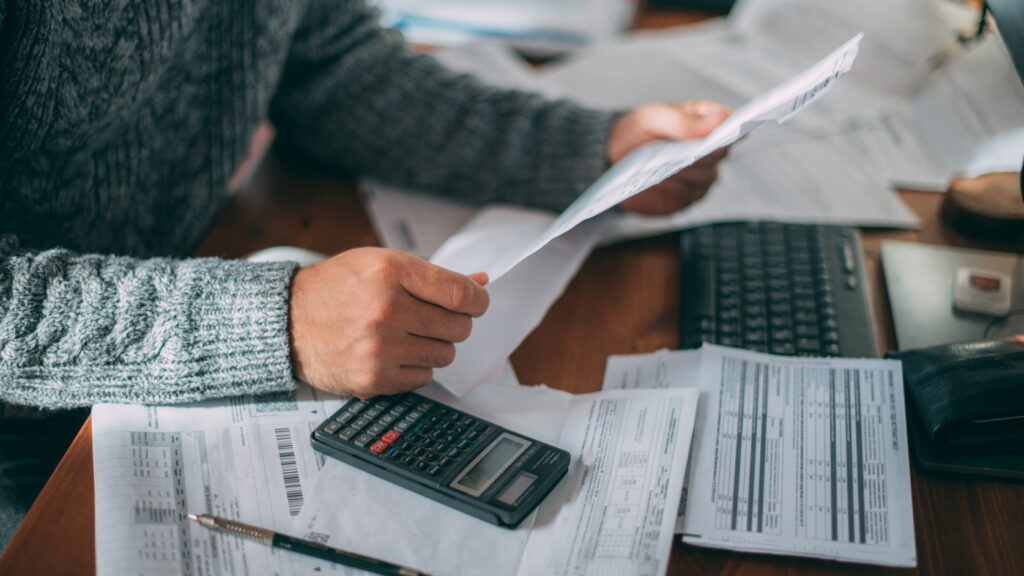 A man looking at some paperwork.