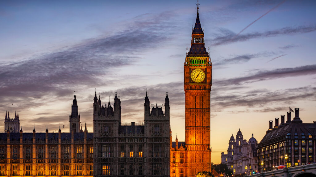 An external image of the Palace of Westminster in the evening