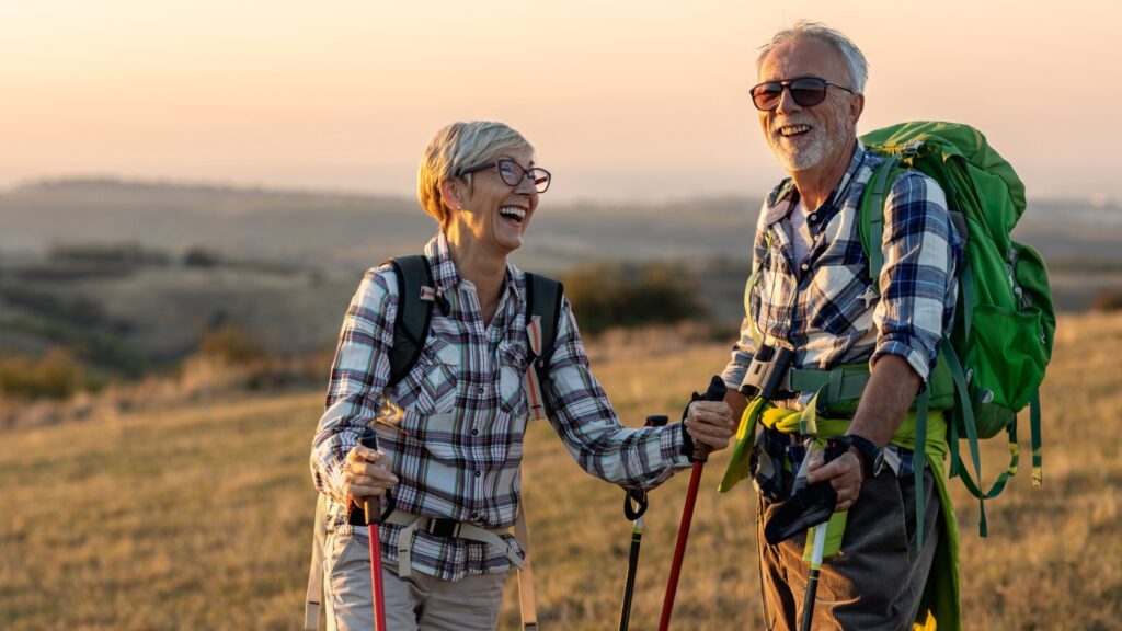 A retired couple hiking.