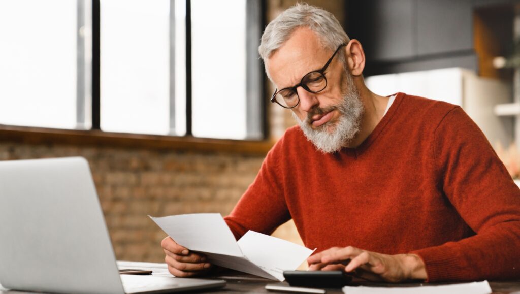 A man reading some paperwork.