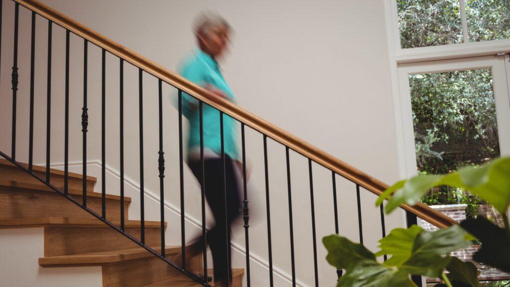 A woman walking downstairs.