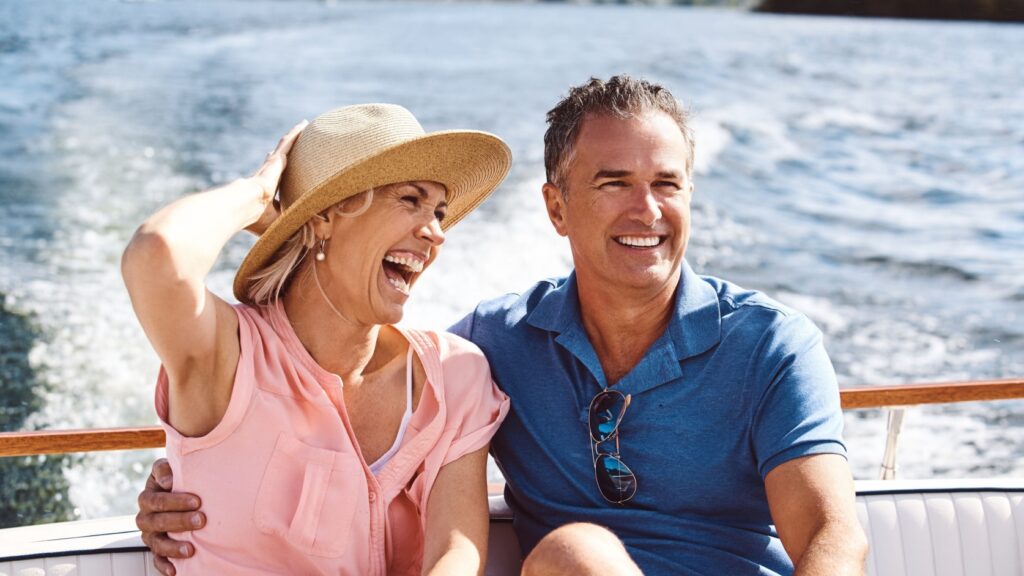 A couple on a yacht cruise.