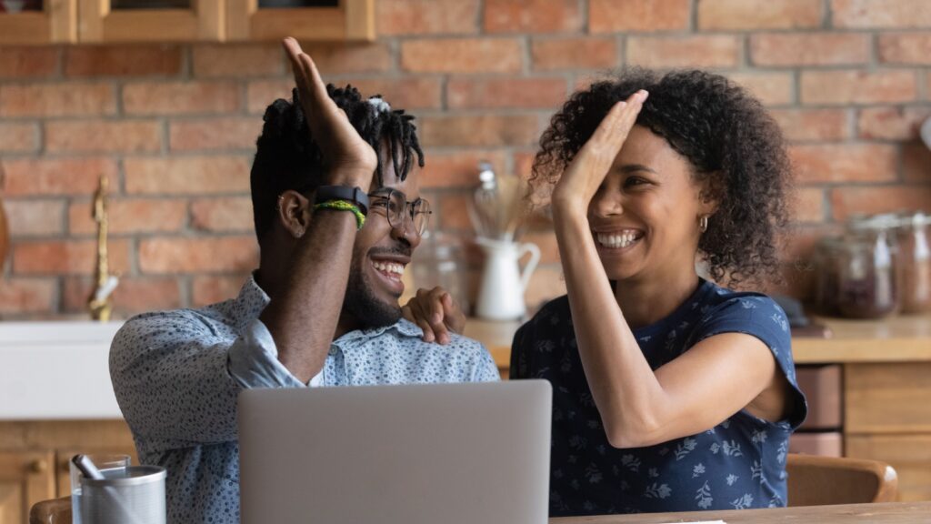 A couple giving a high five.