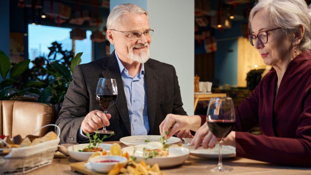 A couple enjoying a meal in a restaurant together.
