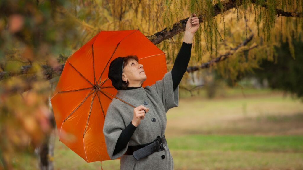 A woman under an umbrella.