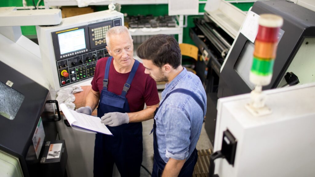 Two workers discussing a project.