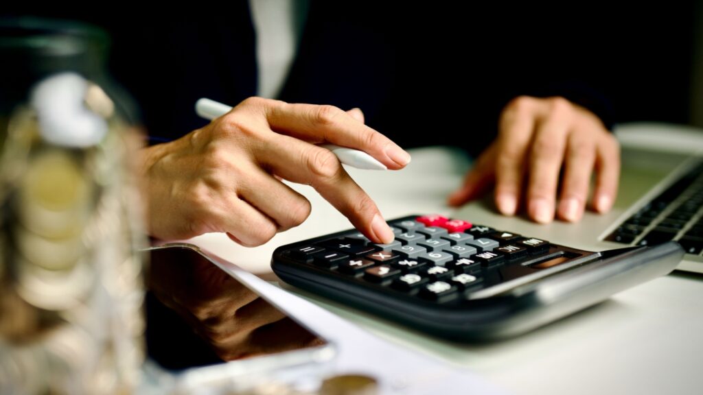 A person using a calculator.