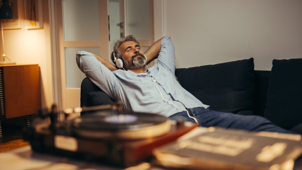 A man relaxing while listening to music.