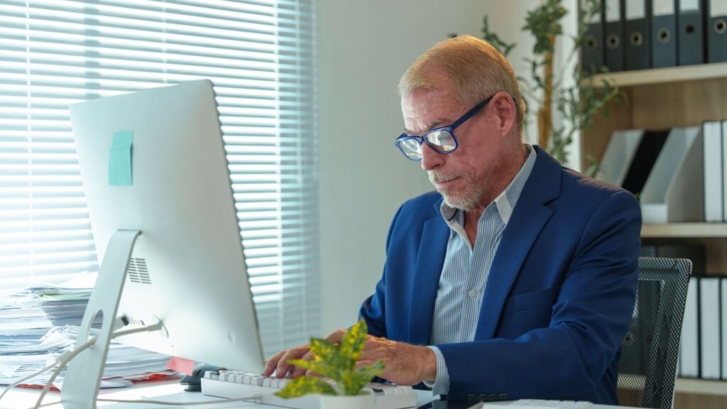 A man working at an office desk.