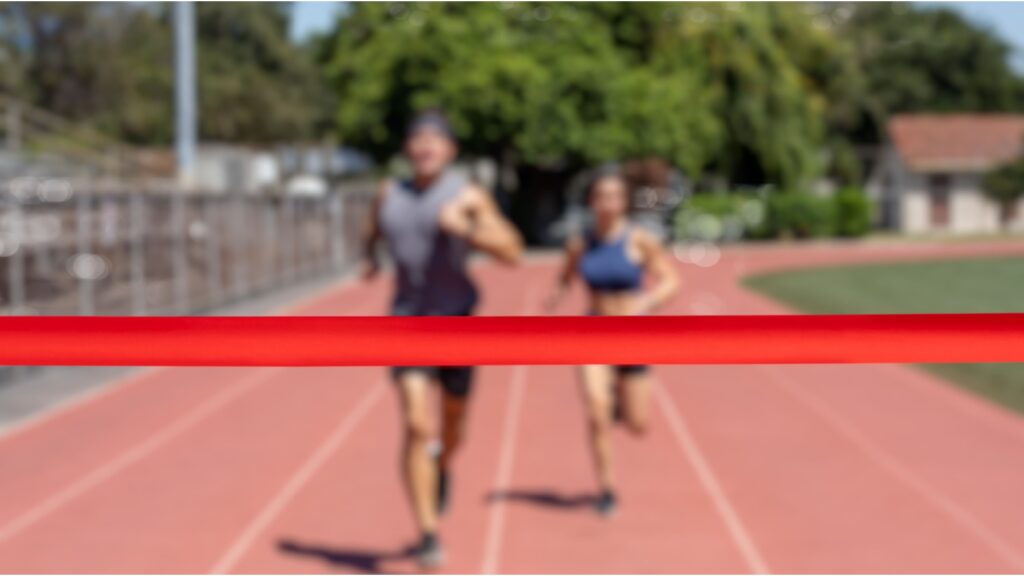 Runners running towards a finish line.