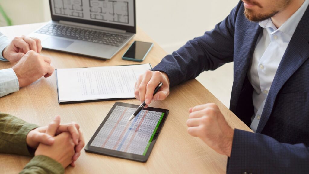 A couple speaking to a mortgage adviser.