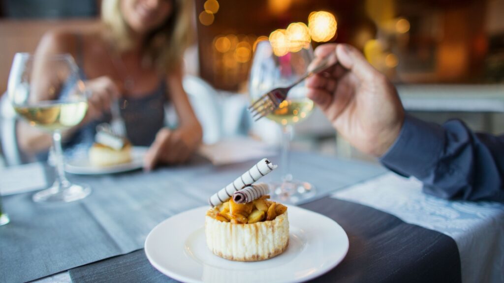 A couple enjoying a meal in a restaurant.
