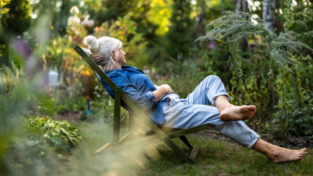 A woman relaxing in a garden