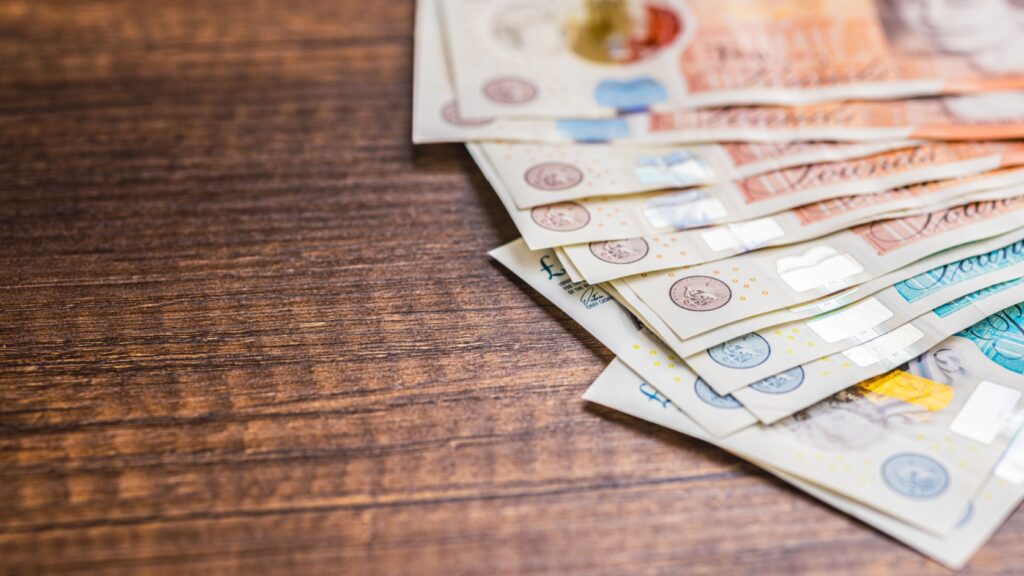 UK bank notes on a table.